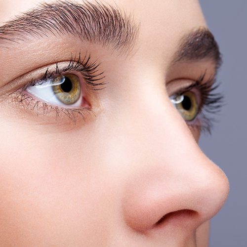 Close up view of young woman after rhinoplasty